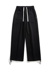 Black relaxed fit drawstring wide-leg sweatpants with adjustable ankle cuffs.