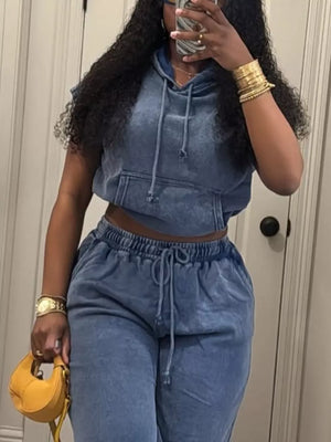 Blue hooded two-piece set with drawstring waist pants and cropped hoodie with front pocket.