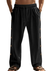 Black linen palazzo trousers with side buttons and drawstring waist.