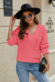 Cross-front ribbed knit sweater in strawberry with a V-neck and long sleeves.