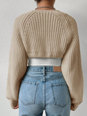 Khaki acrylic cropped bolero shrug with ribbed knit and balloon sleeves.