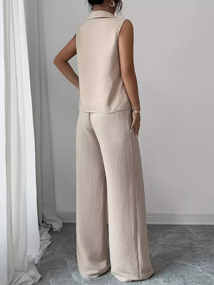 Beige sleeveless collared top and wide-leg pants set with textured fabric.