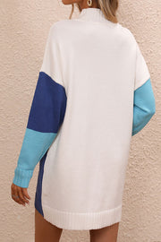 Geometric colorblock knit mini dress with mock neck and colorblocked sleeves in white, dark blue, and light blue.