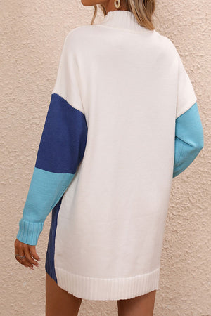 Geometric colorblock knit mini dress with mock neck and colorblocked sleeves in white, dark blue, and light blue.
