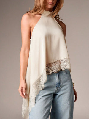 Beige halter camisole with lace trim and asymmetrical hem.