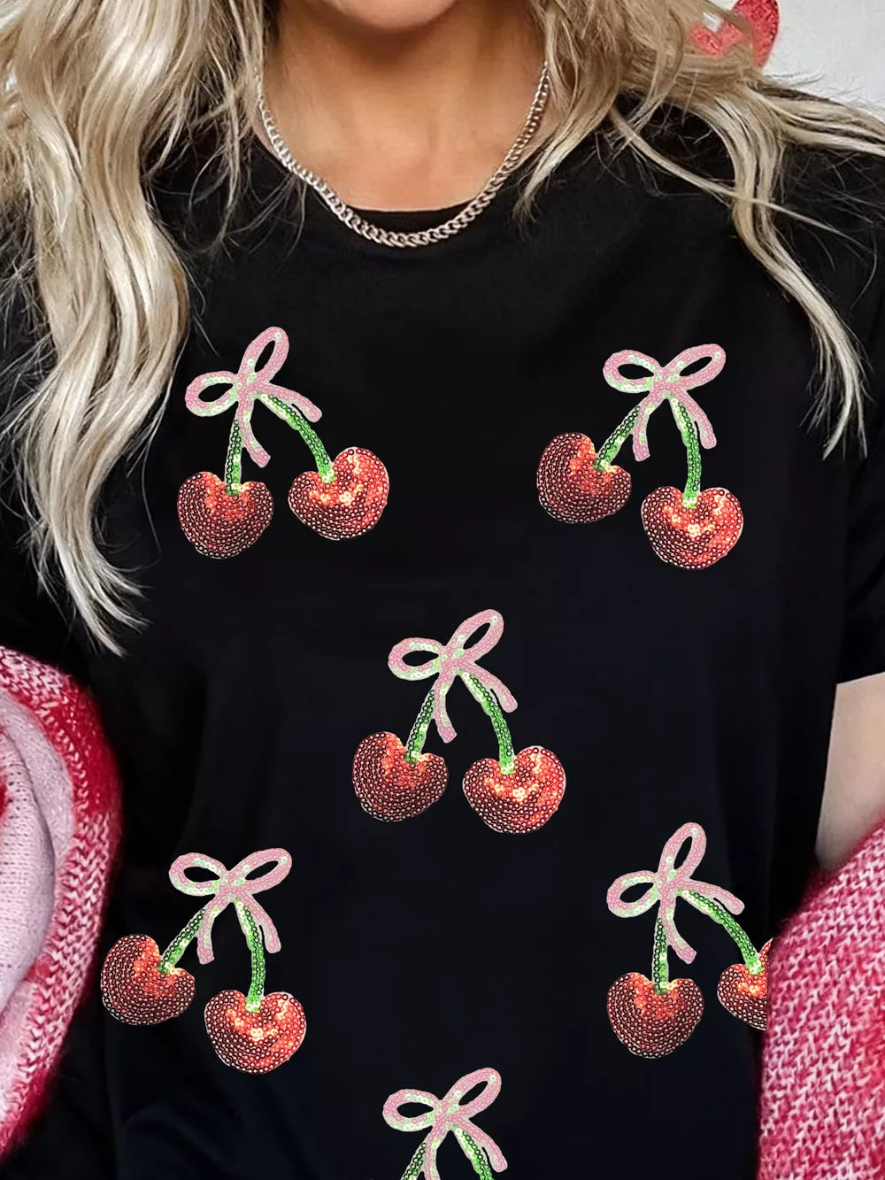 Black cotton tee with sequin cherry and bow pattern