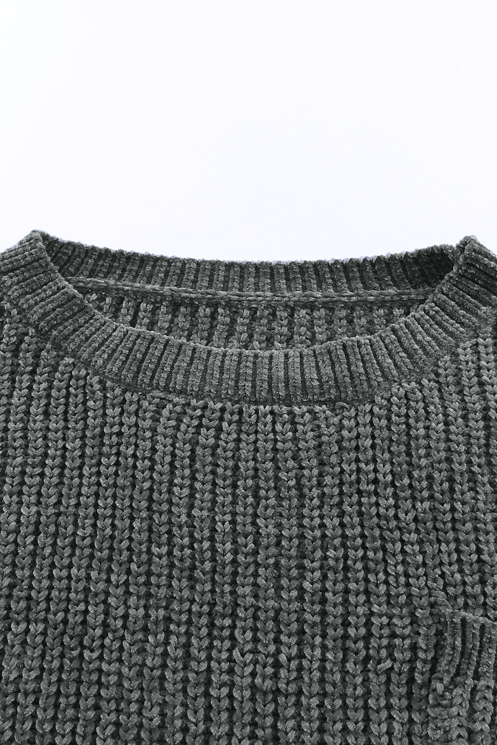 Dark gray distressed knit sweater with crew neck and visible pocket detail.