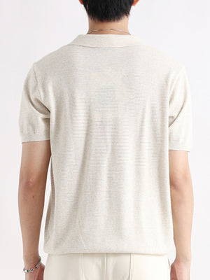 Apricot short-sleeve knit polo shirt with button detail, breathable cotton fabric.