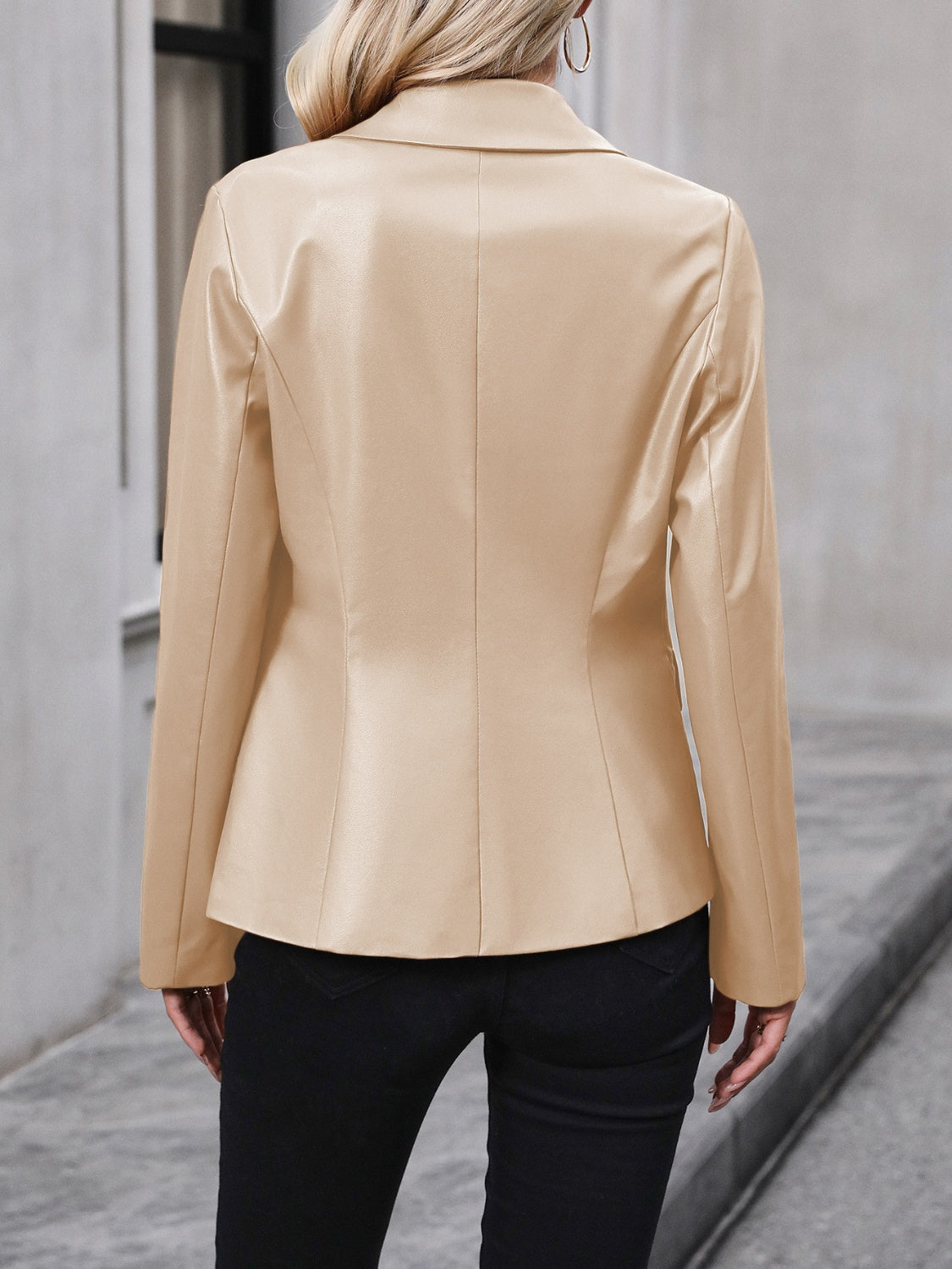 Khaki faux leather double-breasted blazer with a classic collar and long sleeves.
