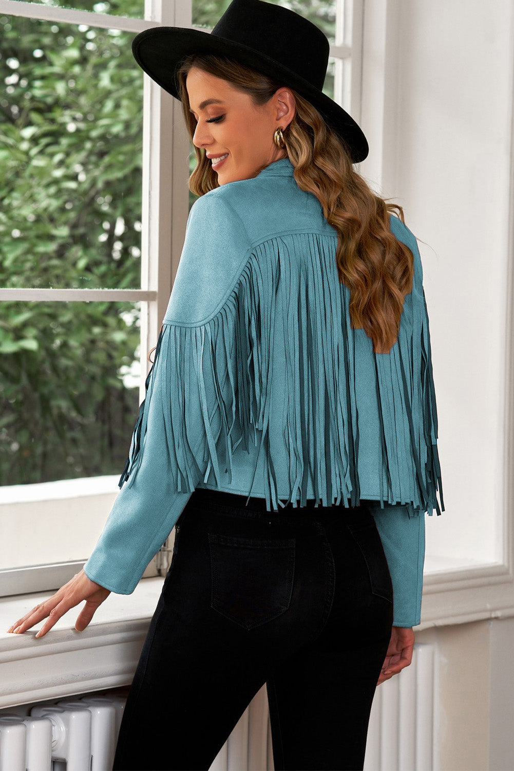 Teal suede cropped western jacket with fringe detail.