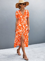 Orange-red floral print midi dress with puff sleeves and front slit