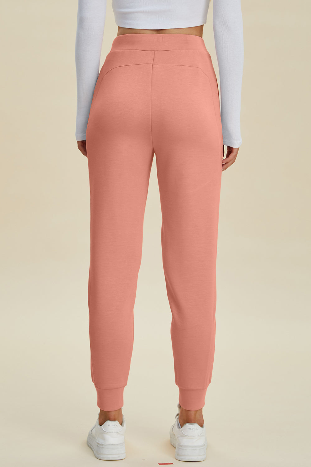 Coral joggers with a comfortable fit and cuffed ankles.