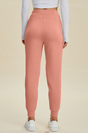Coral joggers with a comfortable fit and cuffed ankles.
