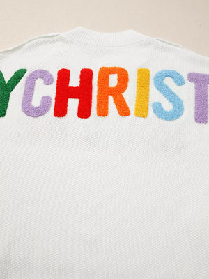 White chenille holiday sweater with colorful embroidered "Y CHRIST" text, crew neck.