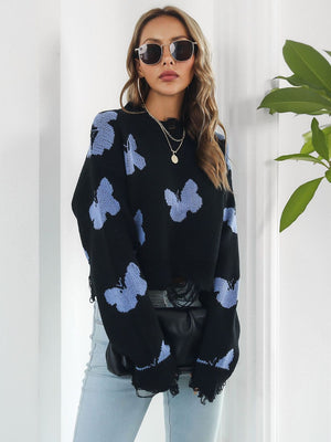 Black cropped knit sweater with distressed butterfly print and frayed hem.