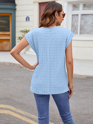 Light blue textured cap-sleeve tee with subtle knit detail.