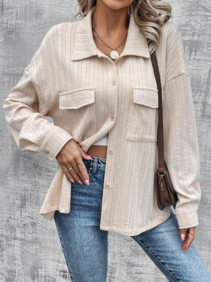 Beige textured overshirt with relaxed fit, button front, and chest pockets.