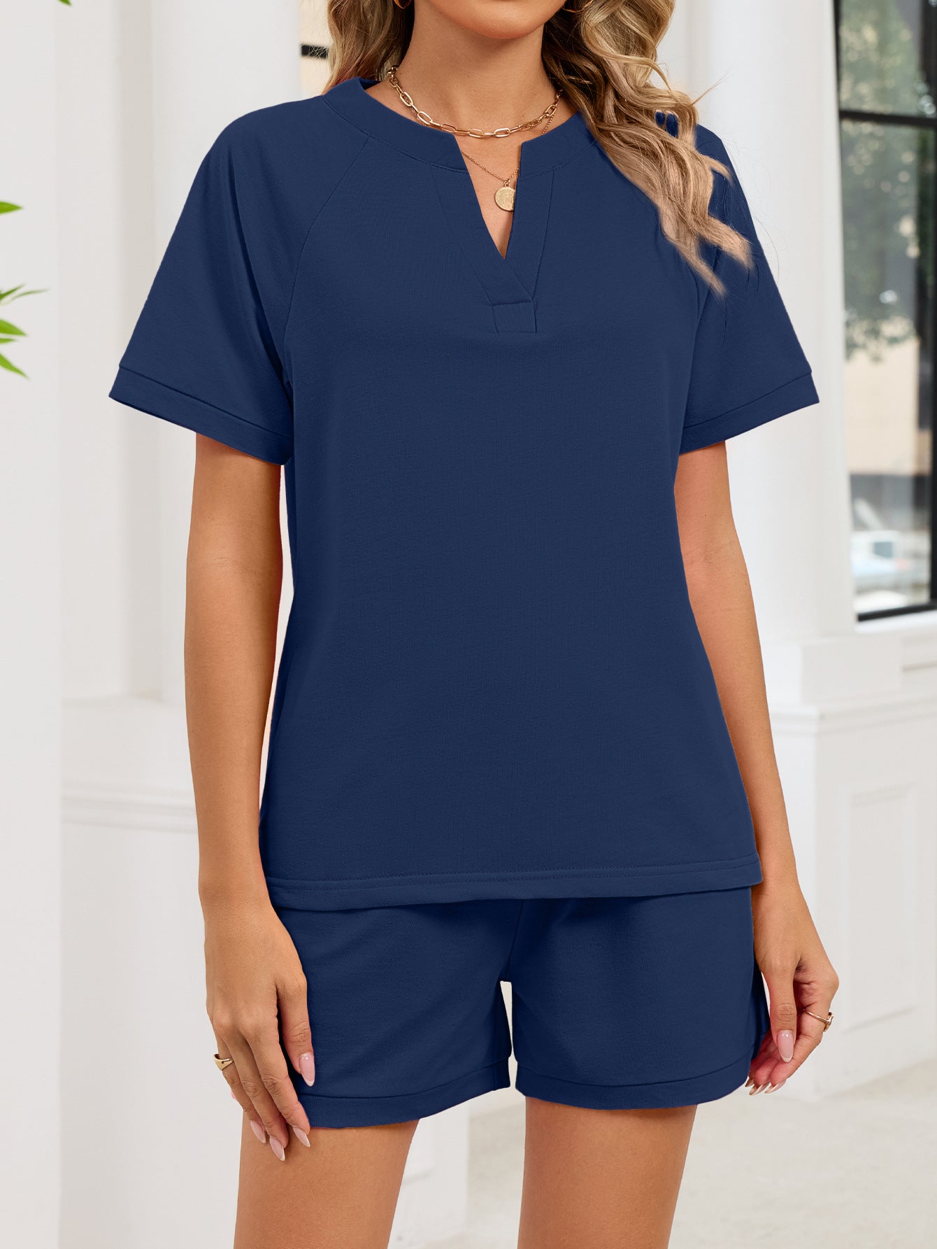 Navy blue loungewear set with v-neck top and shorts.