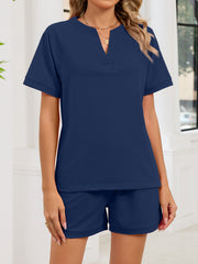 Navy blue loungewear set with v-neck top and shorts.