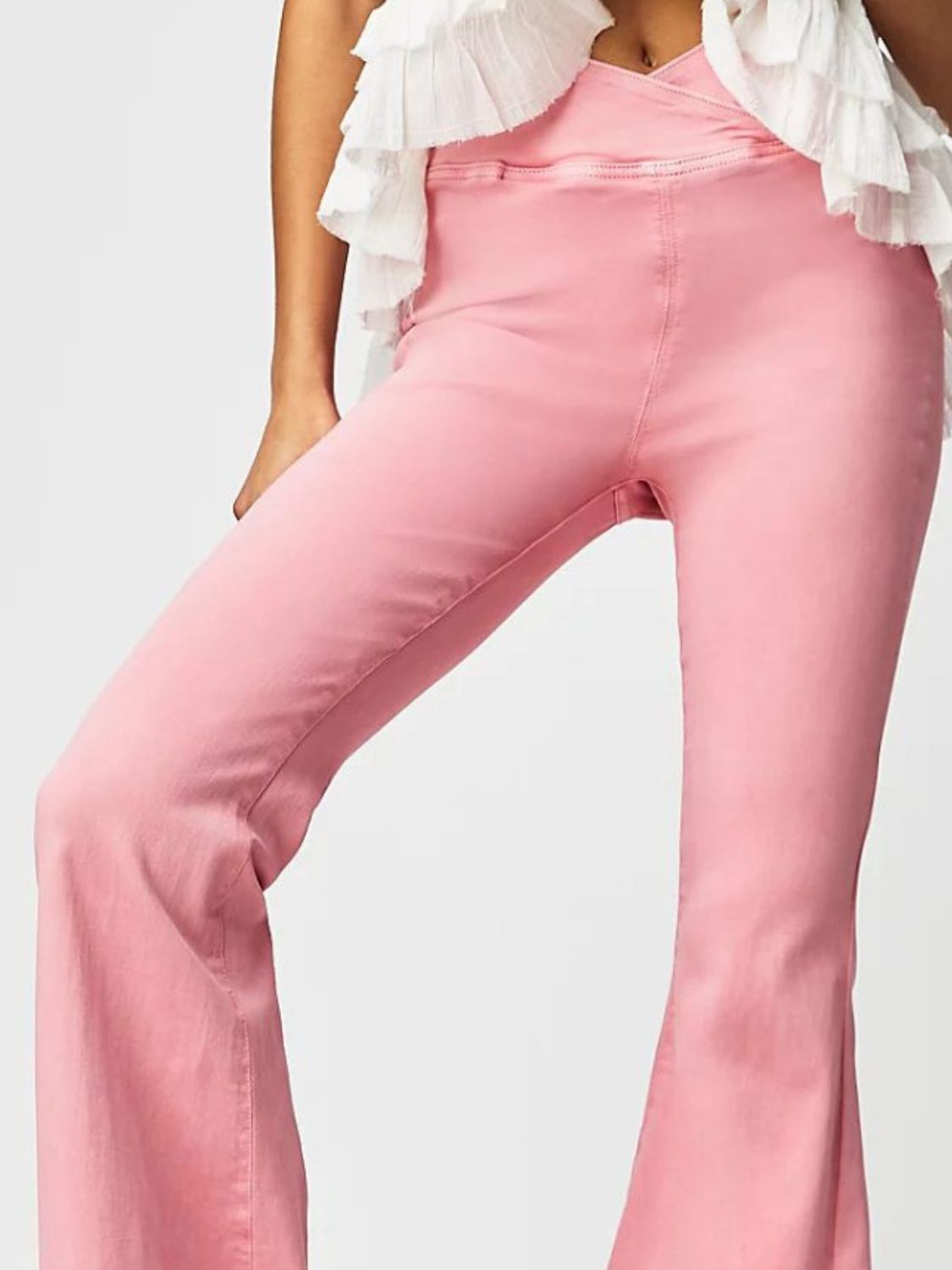 Watermelon pink denim flare jeans with a crossover waist detail