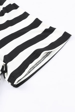 Black and white striped jersey maxi dress detail showing sleeve hem and seam.