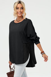 Black split-panel sweatshirt with asymmetric hemline and textured side panels.