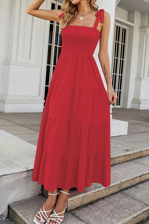 Red tiered ruffle smocked bodice maxi dress with tie straps.