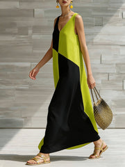 Maxi dress with geometric colorblock in lime and black, V-neck, sleeveless, flowing skirt.