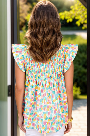 Smocked bodice blouse with flutter sleeves in a brushstroke print.