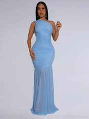 Light blue ruched bodycon maxi dress with one shoulder and sheer mermaid hem.