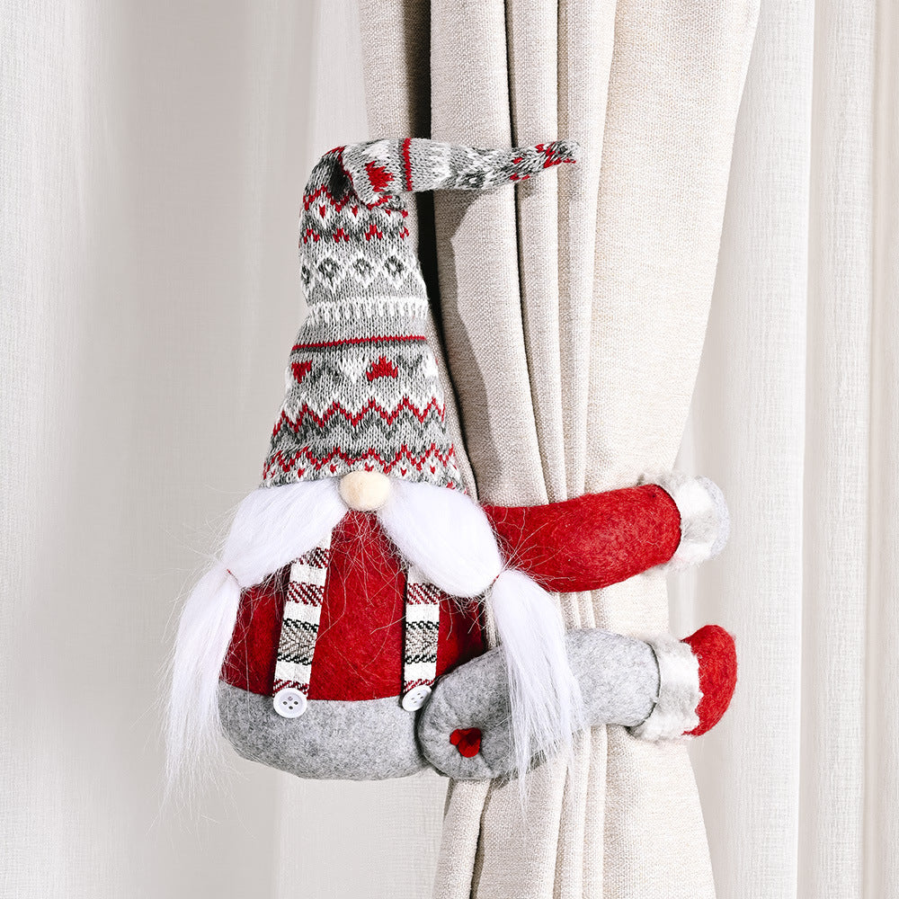 Whimsical gnome curtain tie-backs in red and gray with a knitted hat and beard.