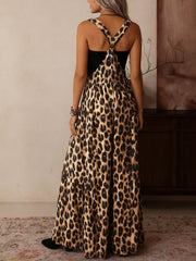 Leopard print wide leg romper with adjustable straps and a black bodice.