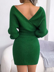 Green wrap knit bodycon mini dress with V-neck and long sleeves.
