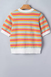 Vibrant abstract knit sweater with crew neck and short sleeves, featuring colorful horizontal stripes and white ribbed trim.