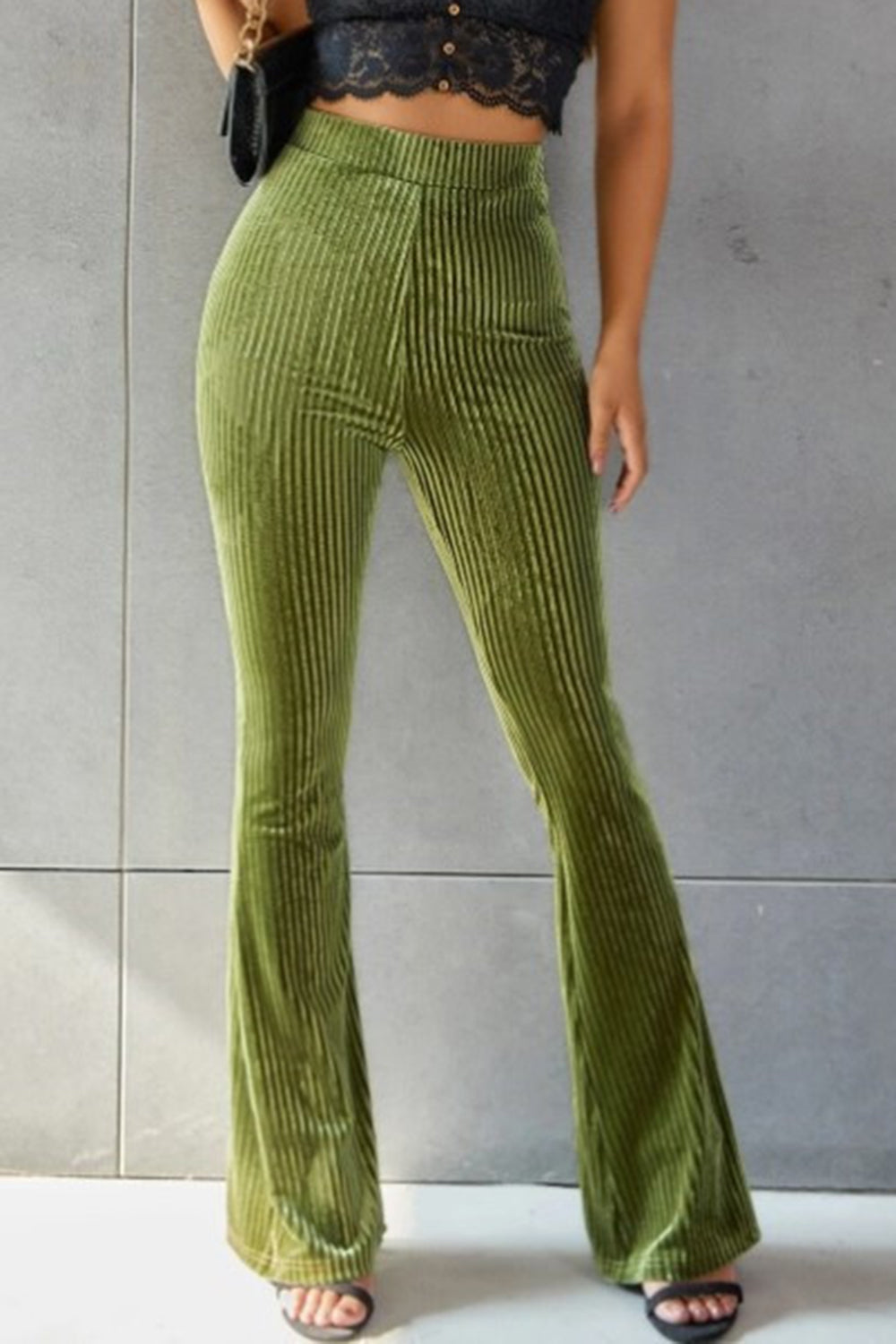 Ribbed velvet palazzo trousers in Matcha Green, high-waisted with a flared leg.