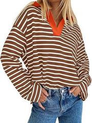 Oversized brown and white striped long-sleeve sweatshirt with orange V-neck collar