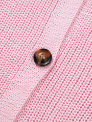 Pink acrylic button front sweater vest with V-neck detail.