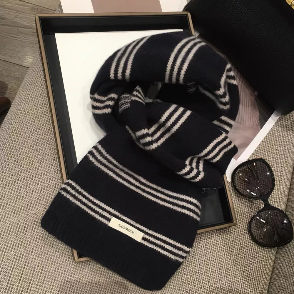Contrast striped wool knit scarf in black and off-white with a 100% wool tag.