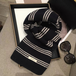 Contrast striped wool knit scarf in black and off-white with a 100% wool tag.