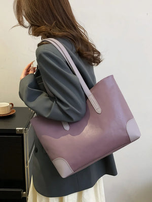 Two-tone panel tote shopper bag in mauve with light grey accents and double straps.