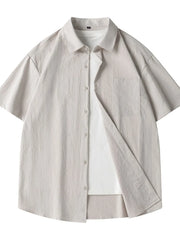 Men's relaxed fit short sleeve button-up shirt in Dust Storm cotton with chest pocket.