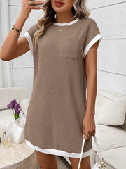 Ribbed knit mini dress in beige with white trim, short sleeves, and a chest pocket.