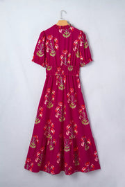 Charming floral tiered midi dress with ruffled neckline and sleeves, smocked waist, and cotton fabric.