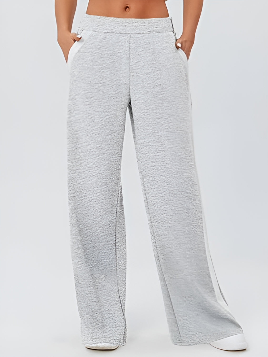 Light gray palazzo trousers with contrast white side panels and textured fabric.