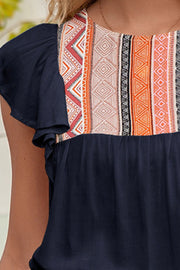 Navy blouse with embroidered yoke and ruffle sleeves
