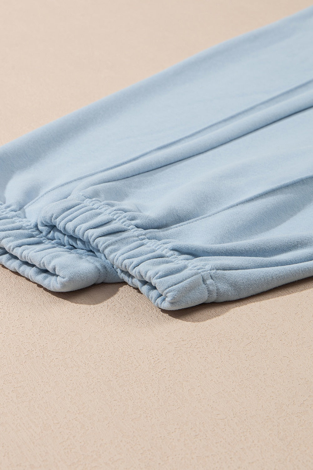 Light blue joggers with elastic waistband detail