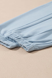 Light blue joggers with elastic waistband detail