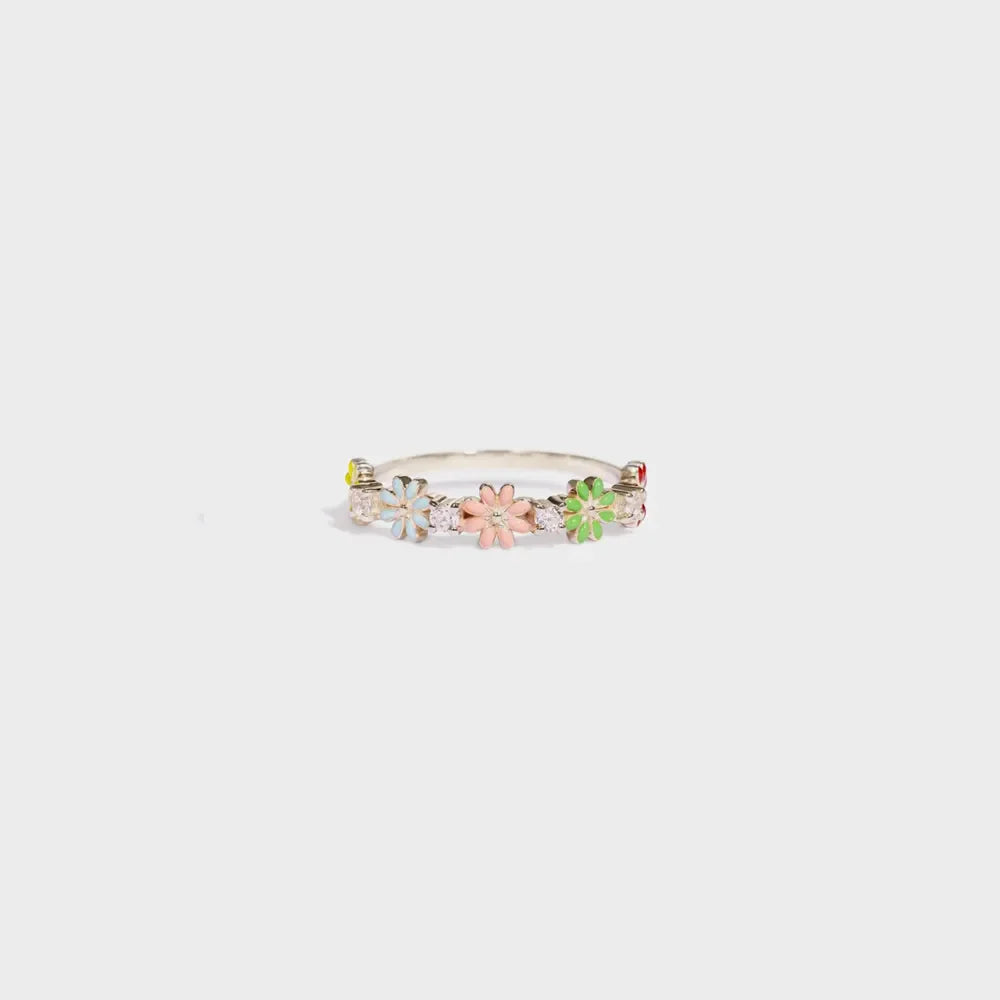 Silver enamel floral cluster ring with colorful flowers and clear stones