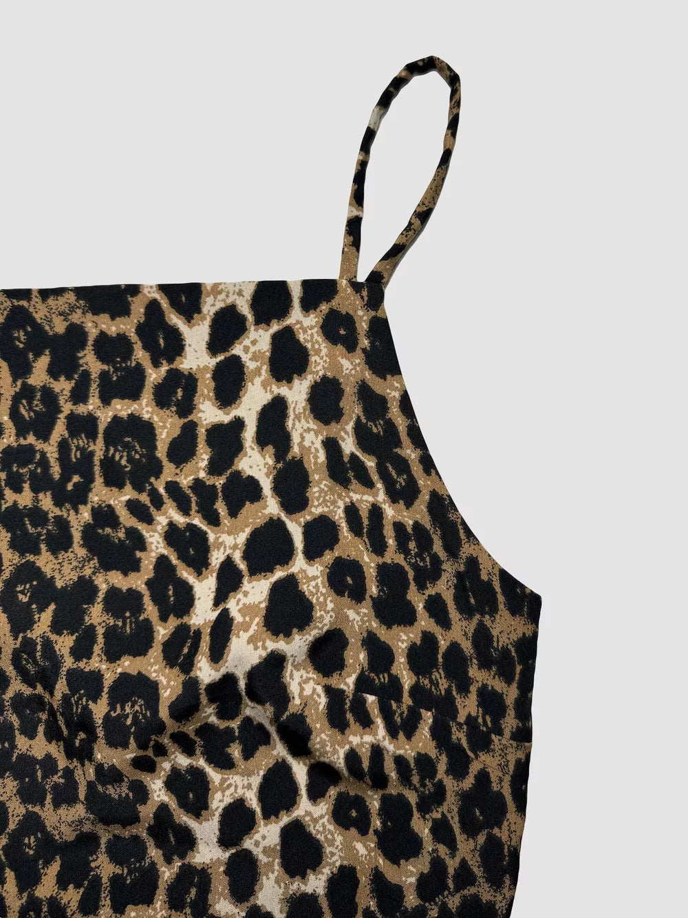 Leopard print cami crop top with spaghetti strap and square neckline.