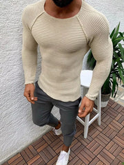 Khaki ribbed knit long sleeve sweater with crew neck and raglan sleeves.